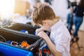 Little boy in robotics school makes robot Royalty Free Stock Photo