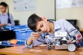 Little boy in robotics school makes robot Royalty Free Stock Photo