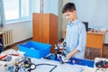 Little boy in robotics school makes robot Royalty Free Stock Photo