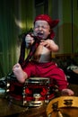 Little boy rocker drummer in red bandana and with drum Royalty Free Stock Photo