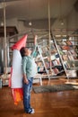 A little boy with a rocket toy on his back is having a good time imagining flying to the space while playing at home. Home, game, Royalty Free Stock Photo