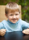 Little boy with roguish smile Royalty Free Stock Photo