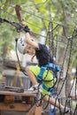 A little boy in a rope Park in the summer Royalty Free Stock Photo