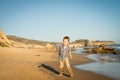 Little Boy running at the beach