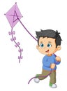 The little boy is running and holding the long kite