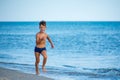 Little boy running at the shore near sea Royalty Free Stock Photo