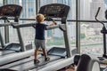 A little boy is running on the treadmill. Children`s sport concept Royalty Free Stock Photo