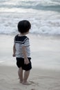 Little boy in sailor`s uniform on beach