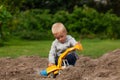 Little boy in the sandbox.