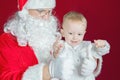Little boy and Santa Claus at Christmas holiday Royalty Free Stock Photo