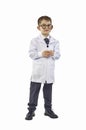 Little boy scientist in eyeglasses and lab coat holding test tube on white background. Education concept.