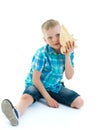 A little boy with a sea shell.The concept of a family vacation a Royalty Free Stock Photo