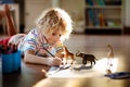 Little boy shadow drawing animals