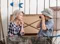 Little boy shooting little girl in big chest Royalty Free Stock Photo