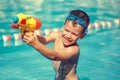 Little boy shooting with water gun in the pool vintage Royalty Free Stock Photo