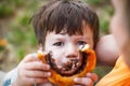 Little boy showing cocoa snail