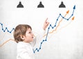 Little boy showing growing graph Royalty Free Stock Photo
