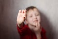 Little boy showing his first lost milk-tooth in his hand. Royalty Free Stock Photo