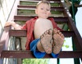 Little boy showing off his dirty feet Royalty Free Stock Photo