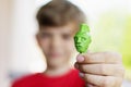 A little boy shows a craft made of plasticine Royalty Free Stock Photo