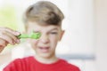 A little boy shows a craft made of plasticine Royalty Free Stock Photo