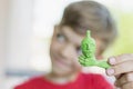 A little boy shows a craft made of plasticine Royalty Free Stock Photo