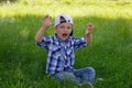 Little boy shows a growling tiger