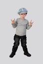 Little boy shows horns (hard rock) gesture Royalty Free Stock Photo