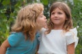 Little boy and shy girl in love. Cheerful kids playing on park outdoors. Summer portrait of happy cute children. Lovely Royalty Free Stock Photo