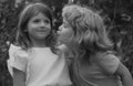 Little boy and shy girl in love. Cheerful kids playing on park outdoors. Summer portrait of happy cute children. Lovely Royalty Free Stock Photo