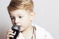 Little Boy Singing In Microphone.child In Karaoke.music