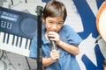 Little boy singing with microphone Royalty Free Stock Photo