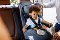 Little boy sitting on the baby seat in a car Royalty Free Stock Photo