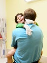 Little boy sitting in doctor's office, laughing Royalty Free Stock Photo