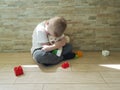 Little sad boy sitting on the floor tenderness unhappy a block depression frustratedsadness Royalty Free Stock Photo
