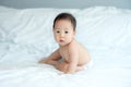 A Little Boy Sitting on Light Blue Blanket