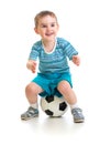 Little boy sitting on soccer ball isolated Royalty Free Stock Photo