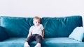 Little boy sitting on sofa Royalty Free Stock Photo