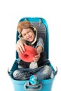 Little boy sitting in suitcase imagine to travel Royalty Free Stock Photo