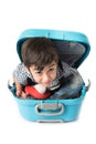 Little boy sitting in suitcase imagine to travel Royalty Free Stock Photo