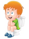 Little boy is sitting on the toilet