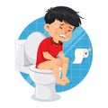 Little boy sitting on the toilet