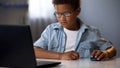 Little boy skillfully using computer mouse to search information on Internet Royalty Free Stock Photo