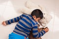 Little boy sleep with teddy bear and brown cat