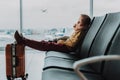 Little boy is sleeping in lobby before flight Royalty Free Stock Photo