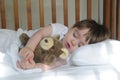 Little boy sleeping with teddy bear Royalty Free Stock Photo