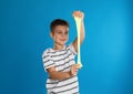 Little boy with slime on blue Royalty Free Stock Photo