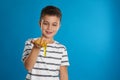 Little boy with slime on blue background Royalty Free Stock Photo