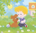 Little boy with a small pup on a lawn