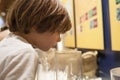 Little boy smelling oriental scents at Interpretive Center of Moriscos Culture in Hornachos, Spain Royalty Free Stock Photo